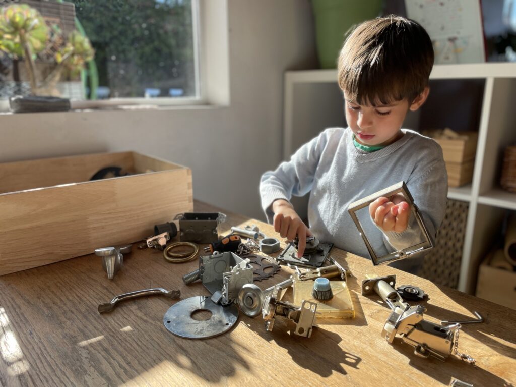 A student building at the design, coding and tinkering workbench