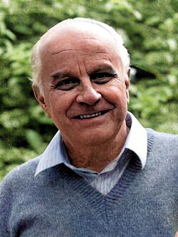 Portrait of a smiling older man photographed outdoors