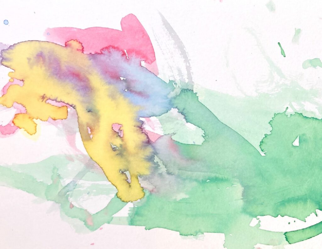Child’s watercolour painting in yellow and green